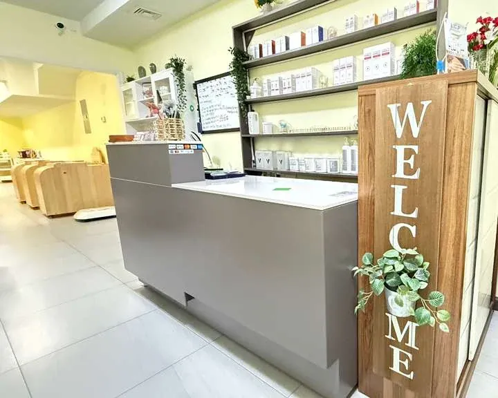 Reception desk with WELCOME sign at The Beauty Story Skincare studio